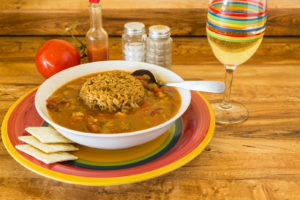 Dish of gumbo with dirty rice